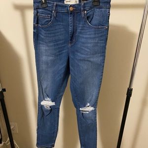 garage skinny jeans with knee rip